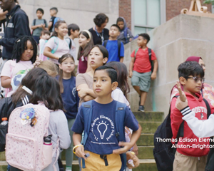 Students and teachers gather on school steps outside Thomas Edison Elementary in Allston-Brighton.