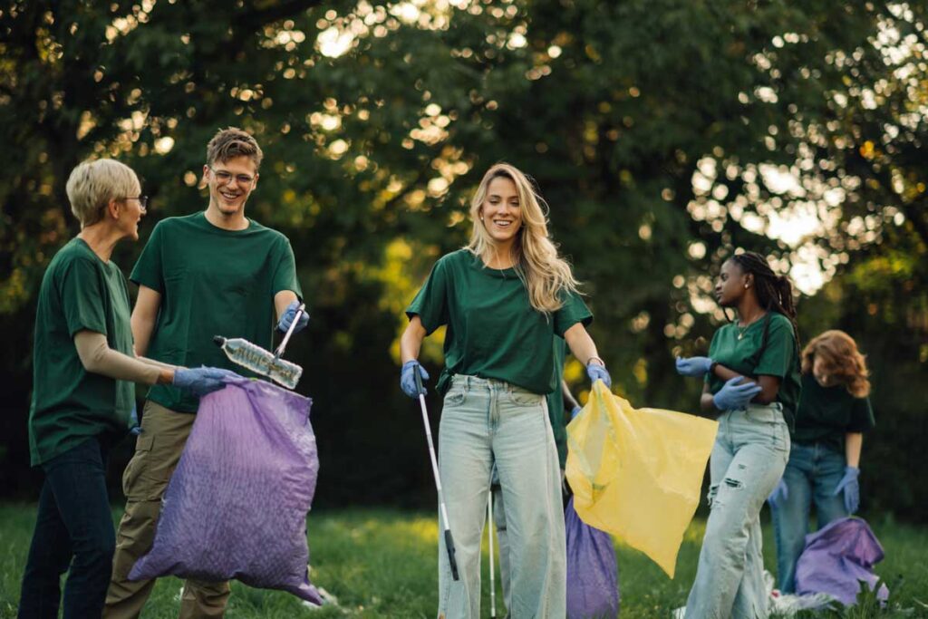 Group of people picking up trash in a public park